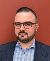 a man in glasses with a beard and moustache