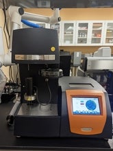 a black, orange and silver piece of equipment