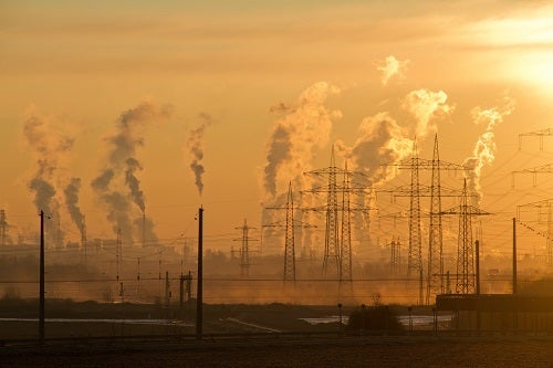 Industrial air pollution with CO2 emissions rising into the atmosphere and changing our climate