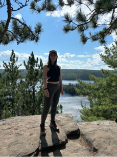 Audrey Kompter standing on a cliff