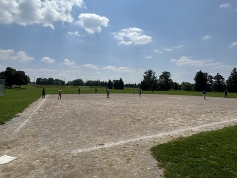 Chemistry graduate students and faculty playing kickball.