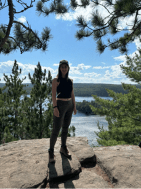 Audrey Kompter standing on a cliff