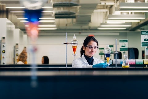 An undergraduate student working in the lab.
