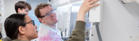 Graduate students working together in the lab.
