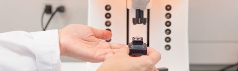 A researcher showing a 3-d printed chemical product.