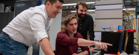 Scott Hopkins and students working in the lab.