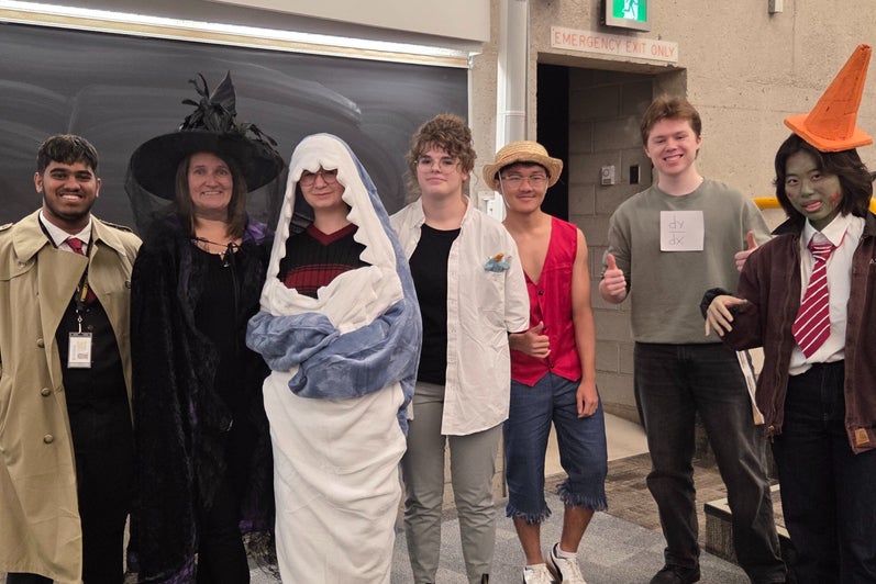 Students standing in costumes