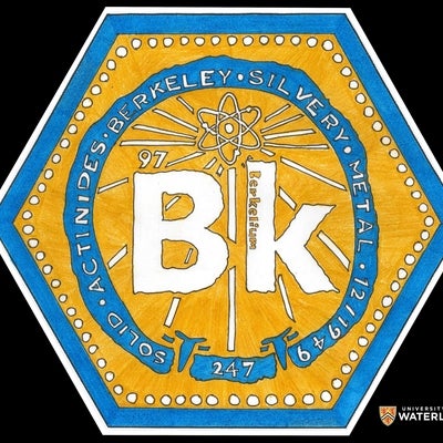 Colored pen and ink with an orange background with blue border. Centre in the middle of a blue circle is the chemical symbol “Bk” with “Berkelium” written in the “k” and a small “97” just above the “B”. Above is a radioactive symbol with lines radiating out. Within the circle are the words “Solid”, “actinides”, “Berkeley”, “Silvery”, “Metal”, “12,1949” and “247”.
