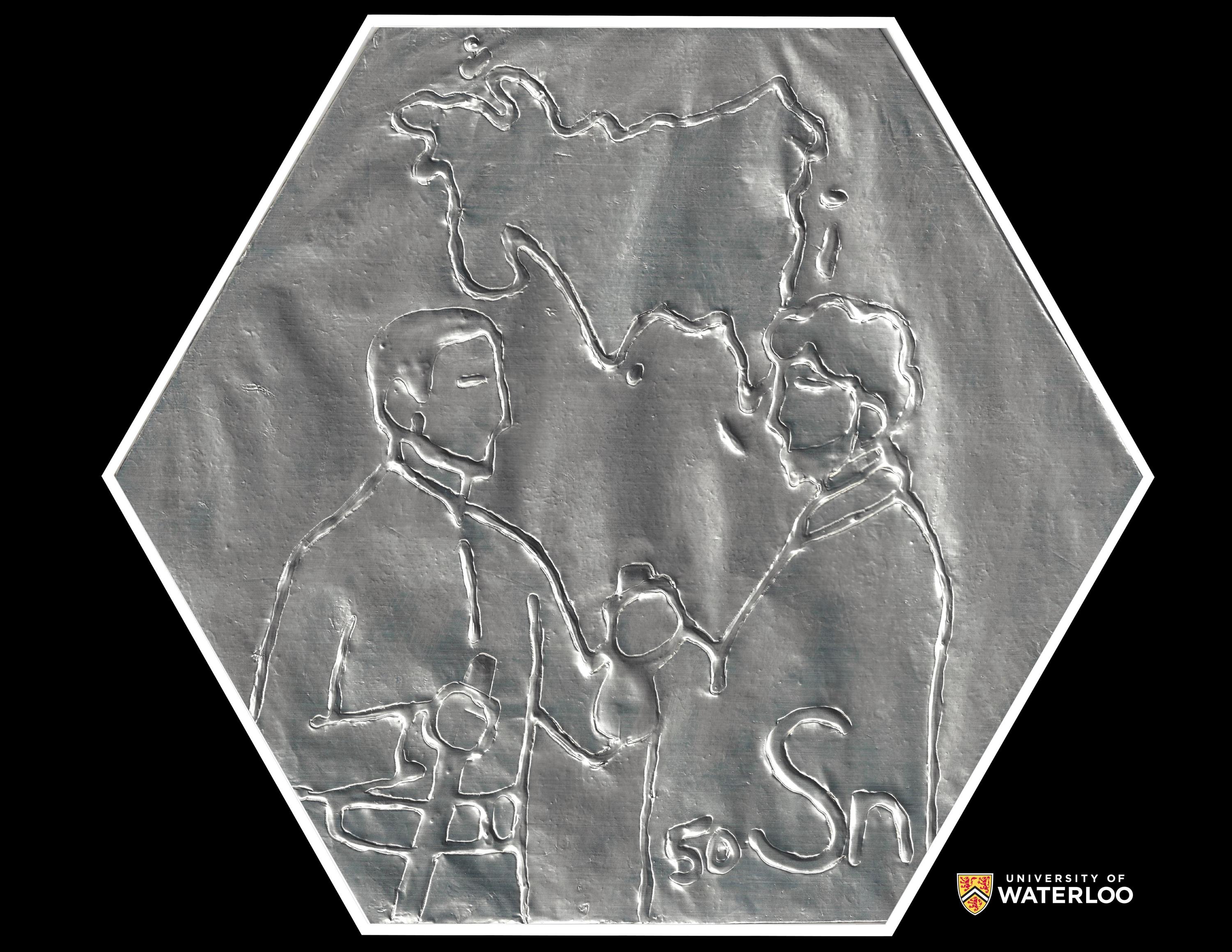 Tin foil relief over cardboard and glue base. Chemical symbol “Sn” and atomic number “50” appear in the lower right corner. Centre are two Bronze Age figures (one holding a sword) trading bronze coins. Above them, a map of Eurasia.