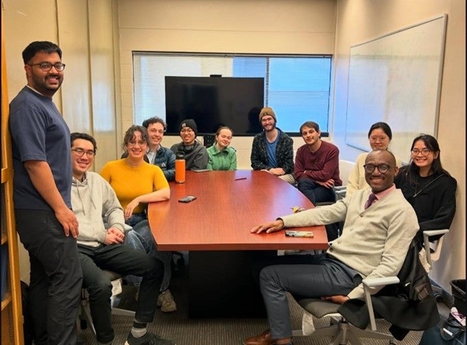 Students around a seminar table.