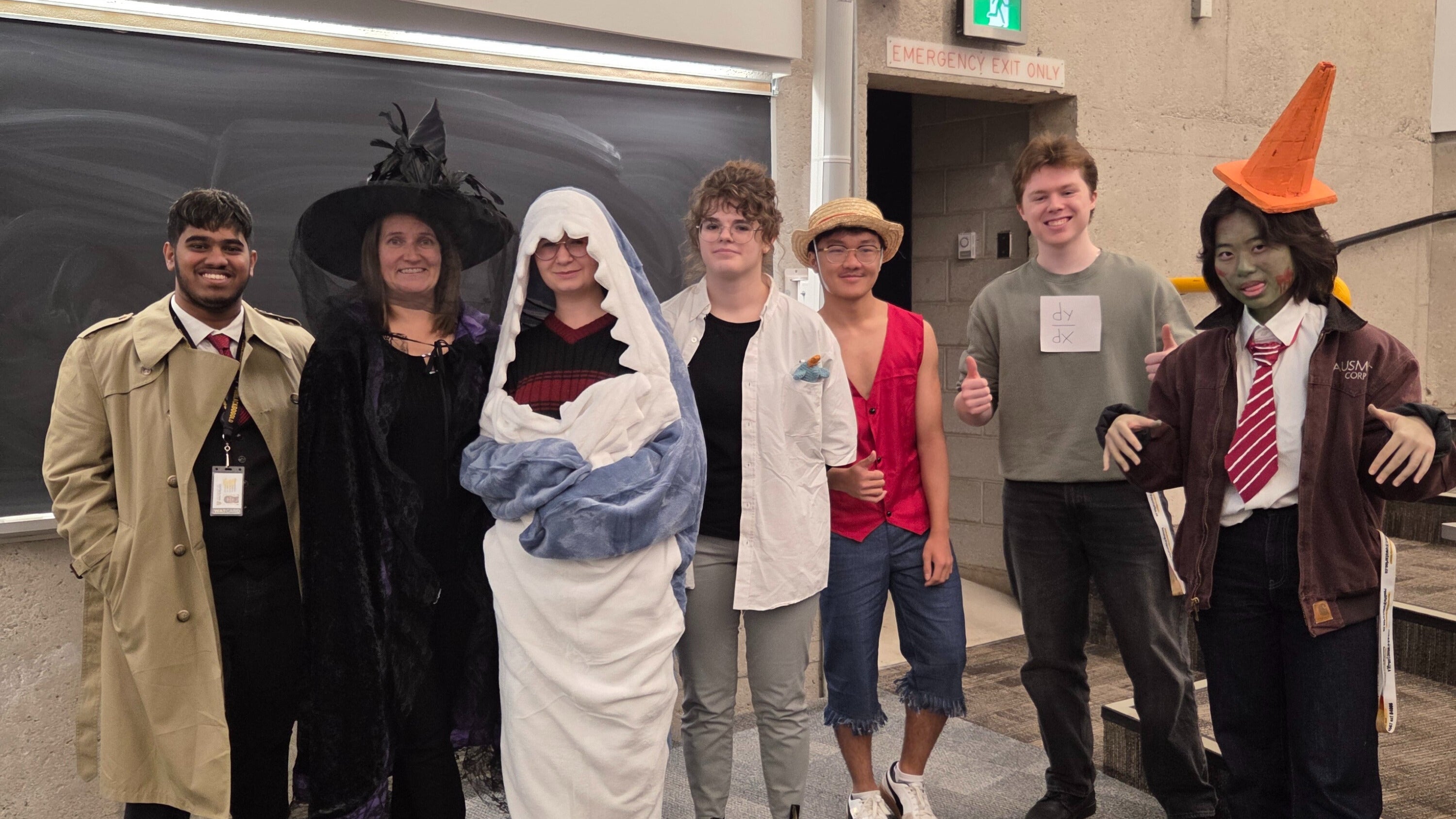 Students standing in costumes