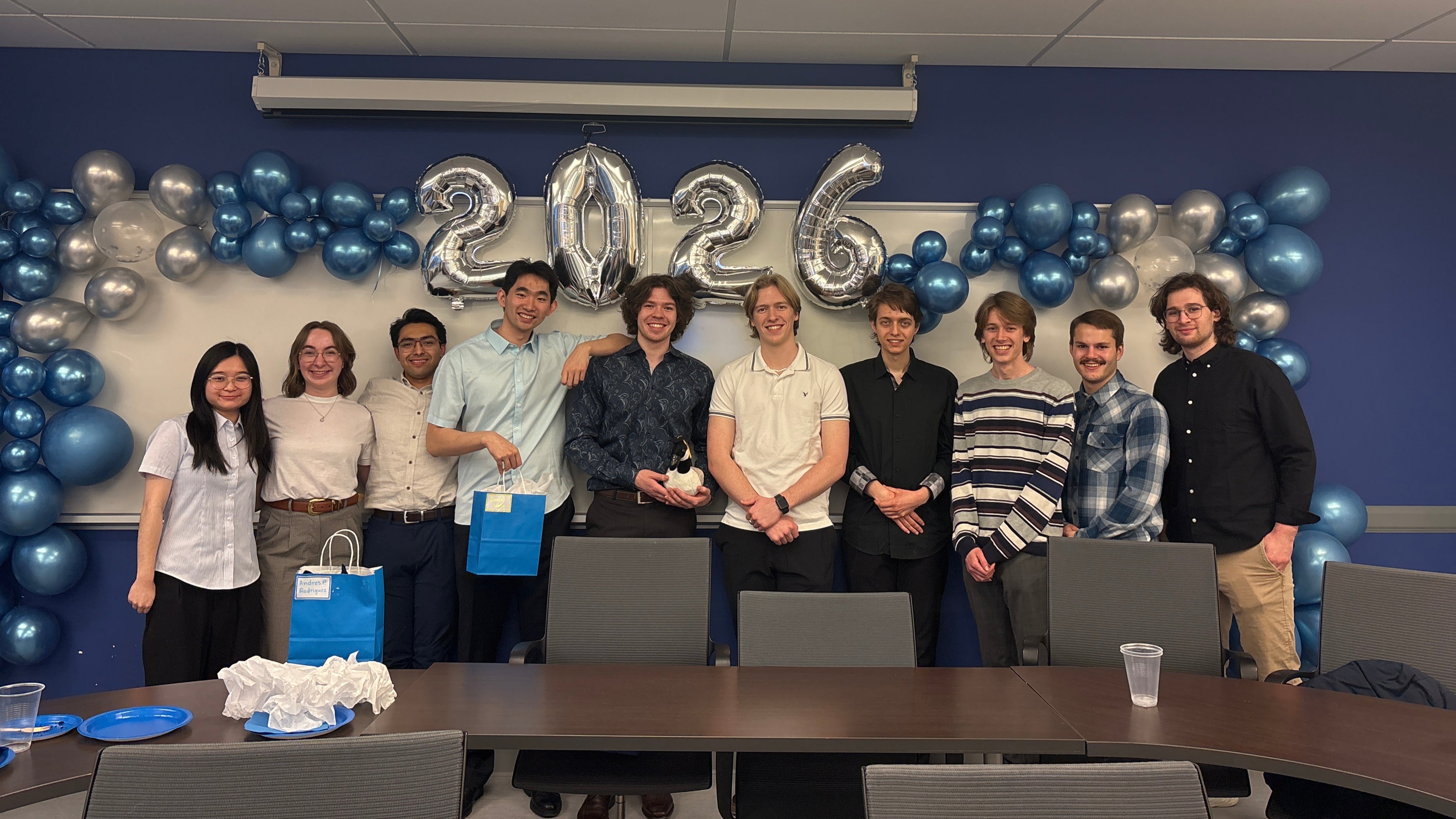 MNS members in front of a 2026 balloon display.