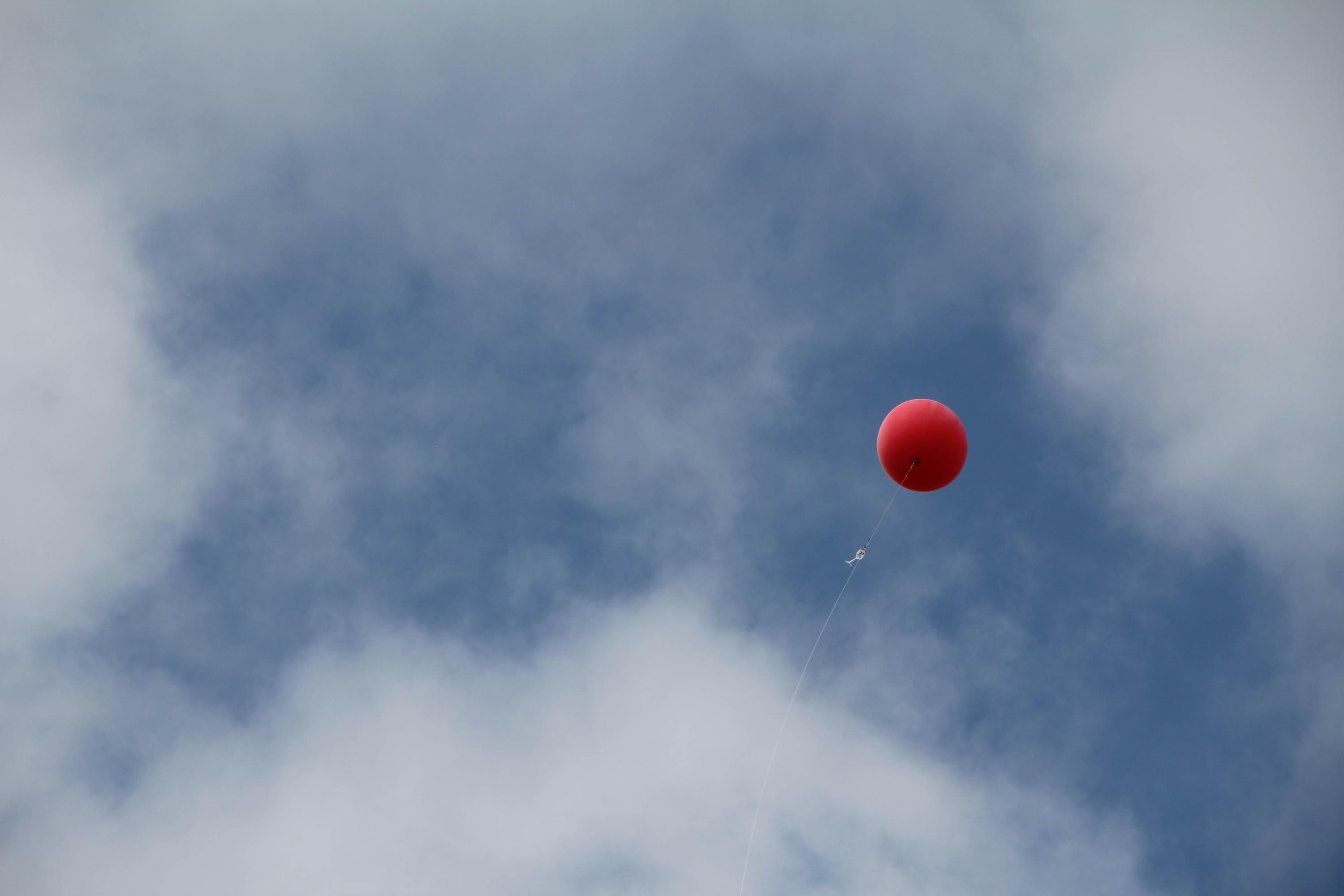 The balloon high in the sky.