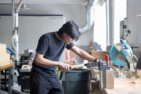 student working in woodshop
