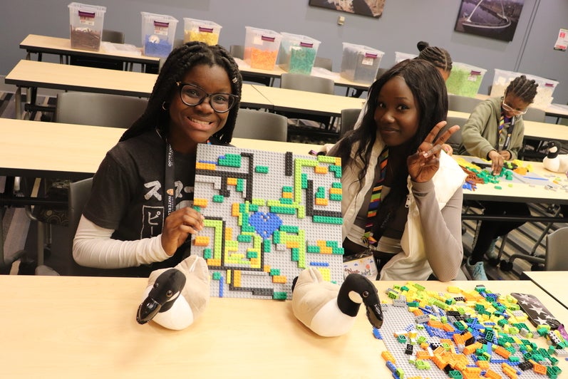 Students showing lego