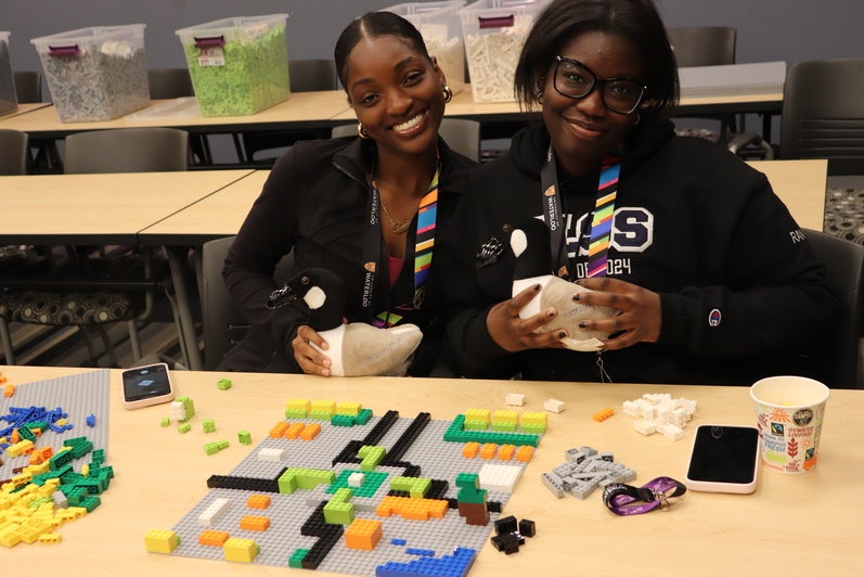 Students showing lego