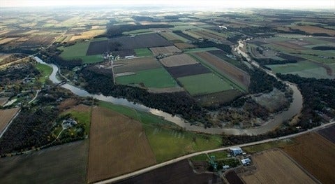 Aerial view of the Grand River and its surrounding fields.