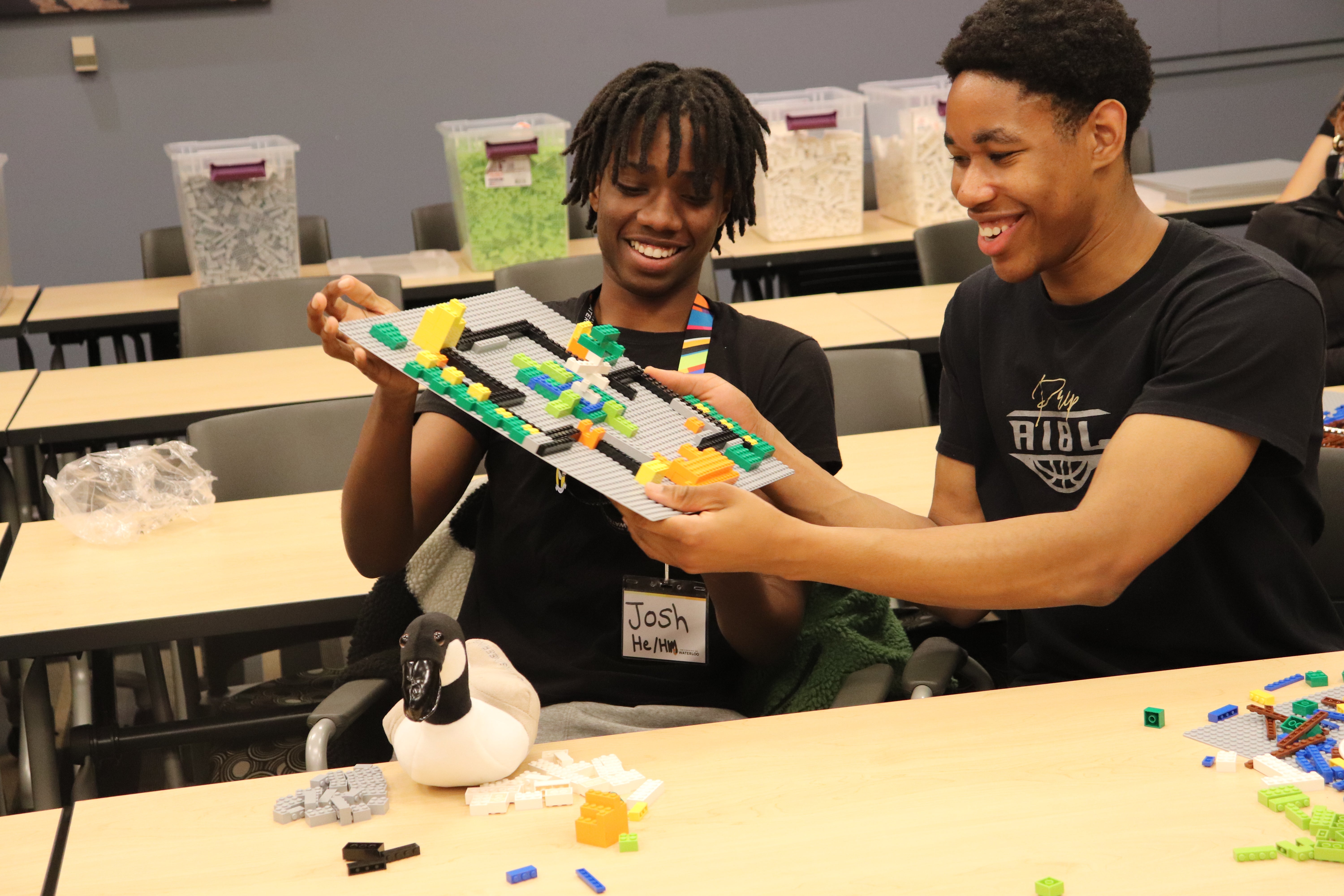 Students showing lego