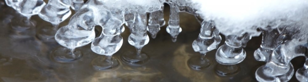 Icicles forming above water