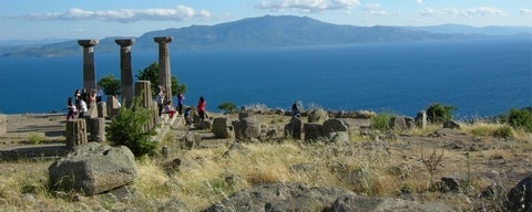 Students exploring ruins on island landscape