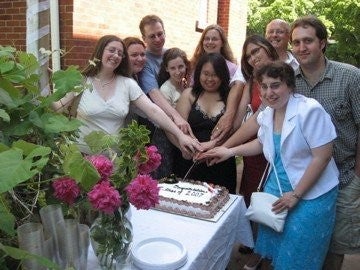 Graduating students and celebration cake