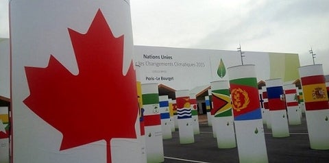 Canadian flag and flags of the world in front of COP21 Climate Change Conference