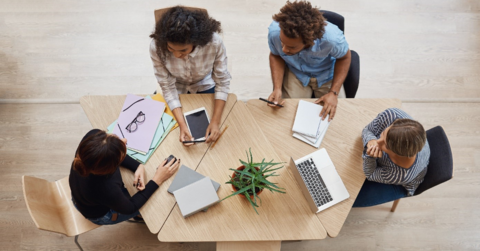 People sitting at a table and working