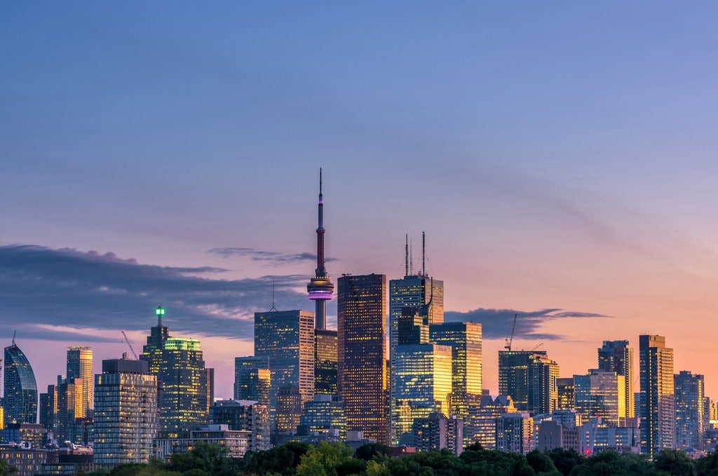 Toronto skyline at night with light glowing