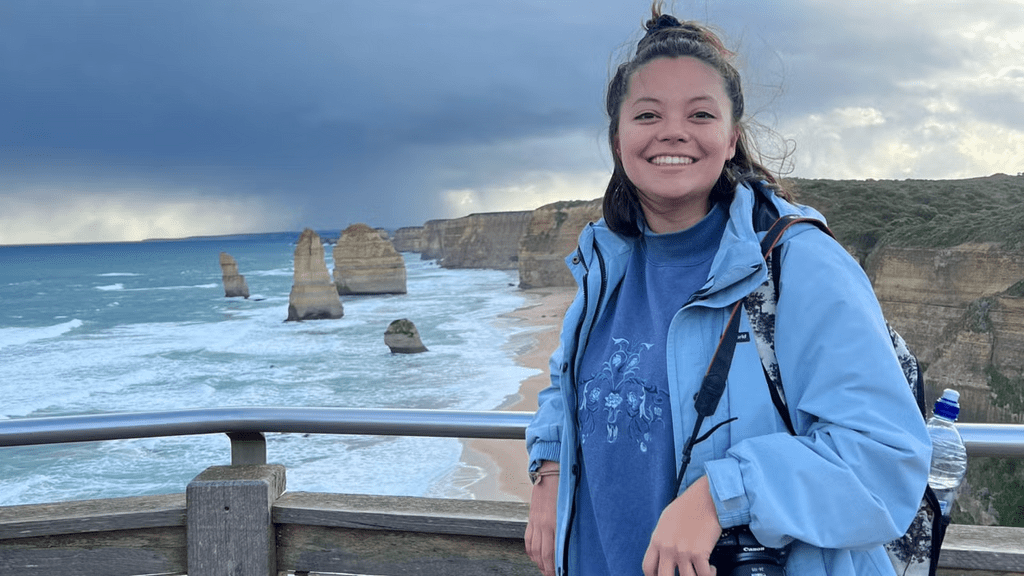 Eloise standing in front of ocean