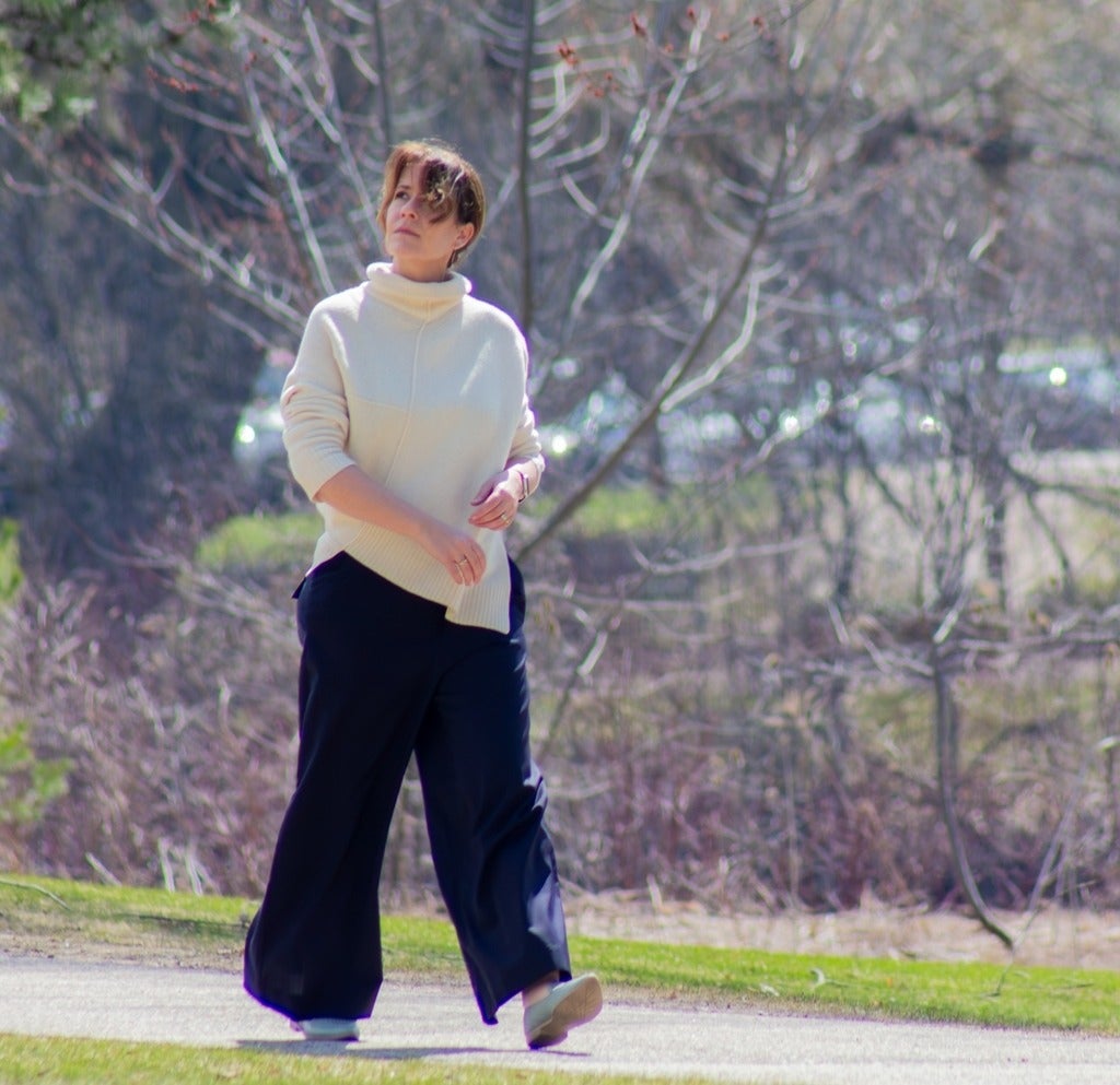 Sarah Burch walking on campus