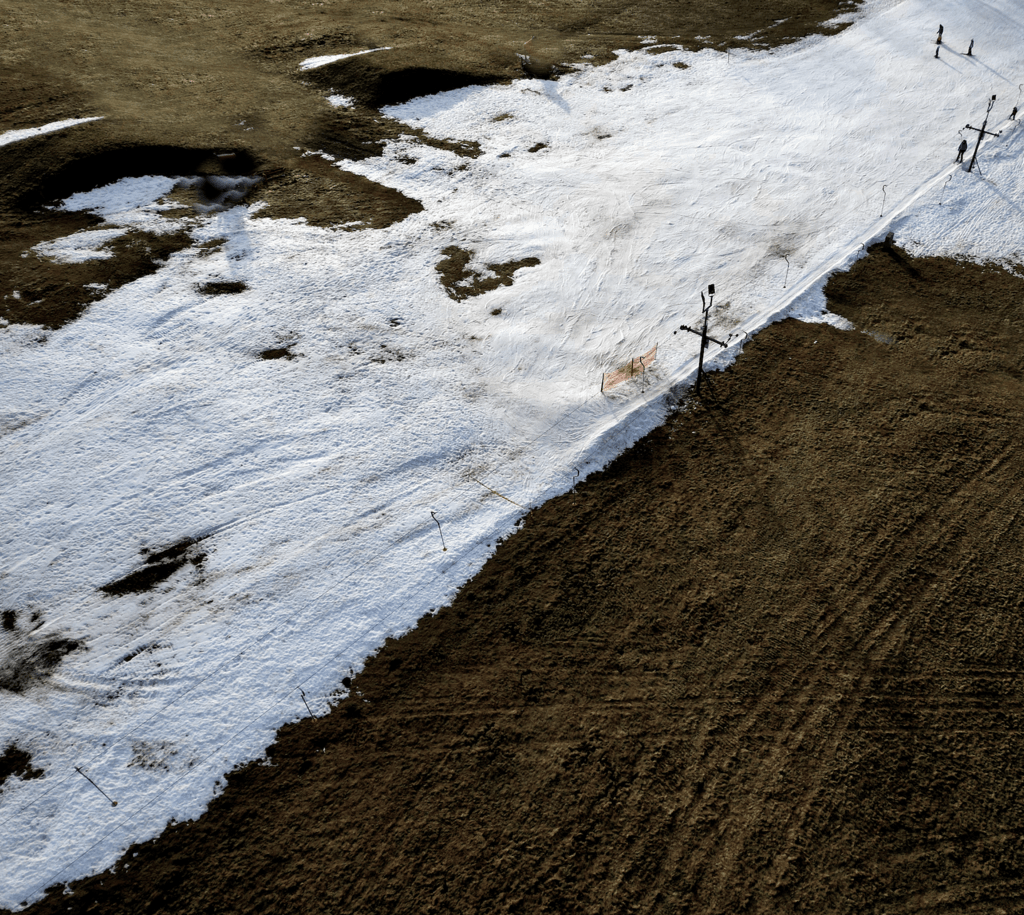 Melting snow on ski hill