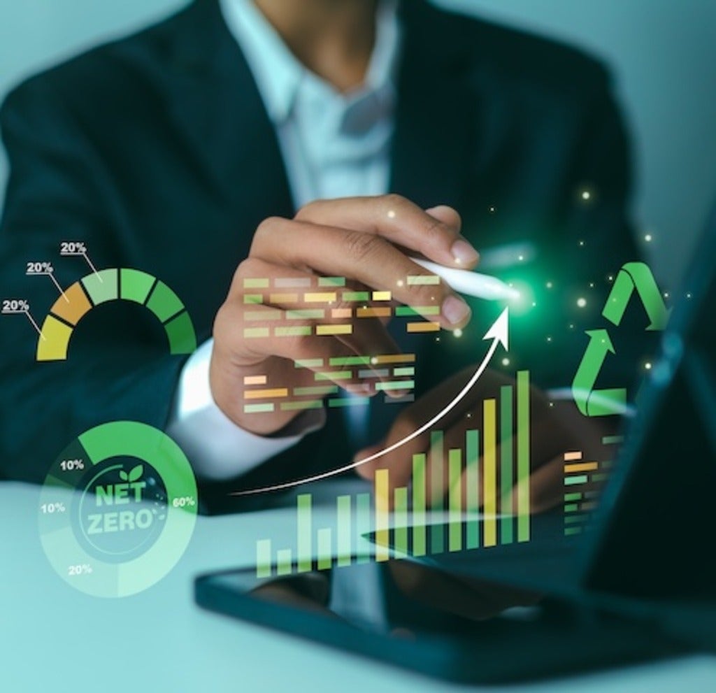 Businessman analyzing ecological data on digital tablet