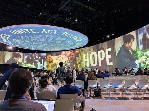 COP28 Dubai digital screen display with images and word "hope"