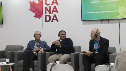 Three people sitting in chairs speaking to each other