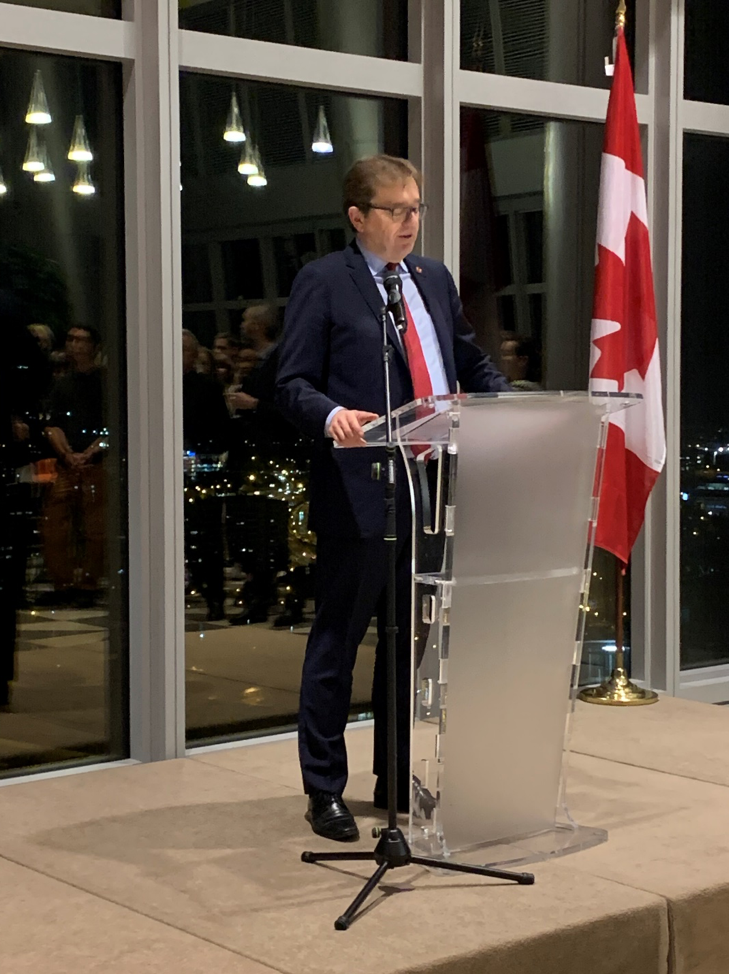 Canadian Minister of Environment Jonathan Wilkinson speaking at the podium.