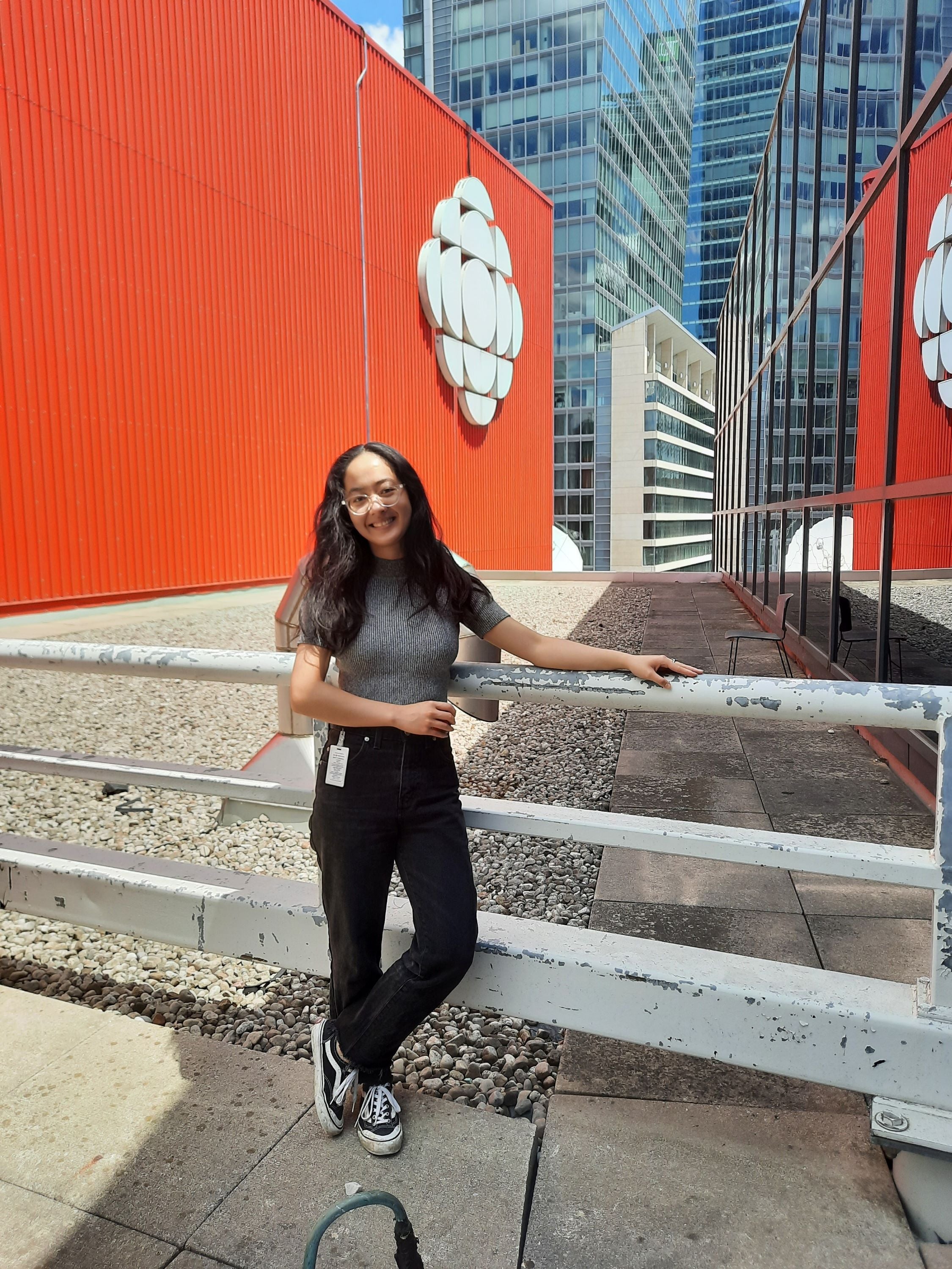Cecilia Qiu standing in front of a building