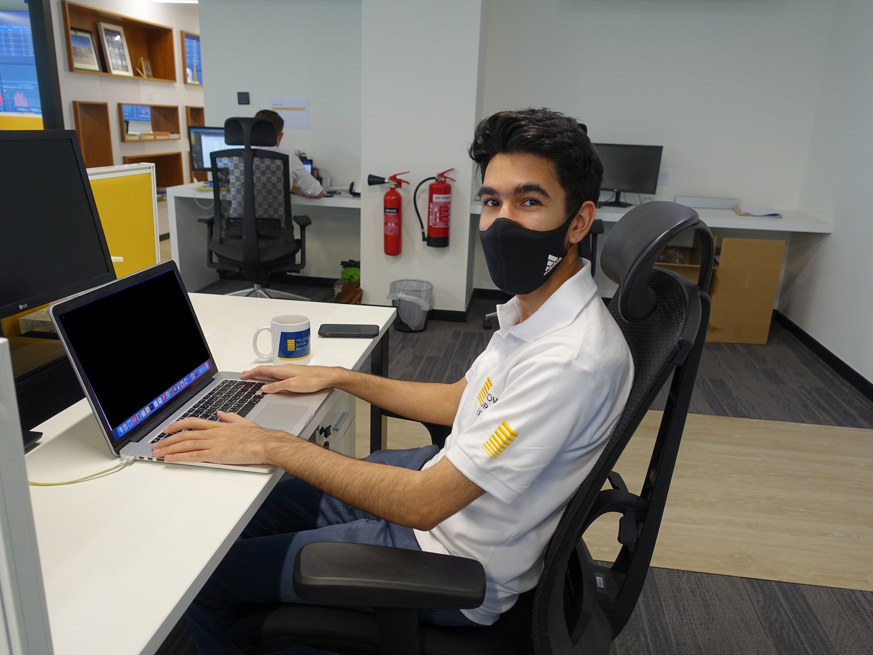 Ayman working at Yellow Door Energy