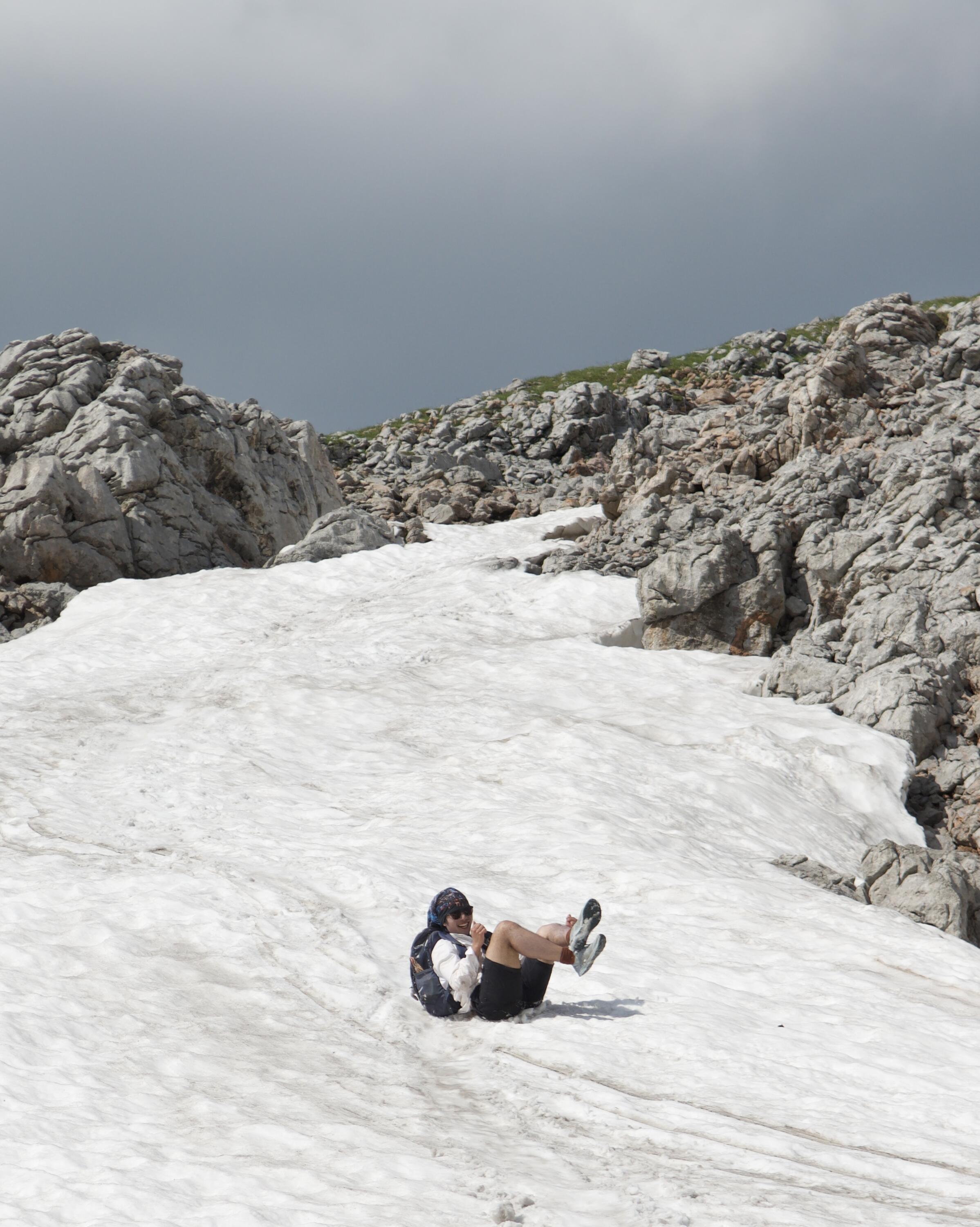 Ryan sliding down an icy mountain.