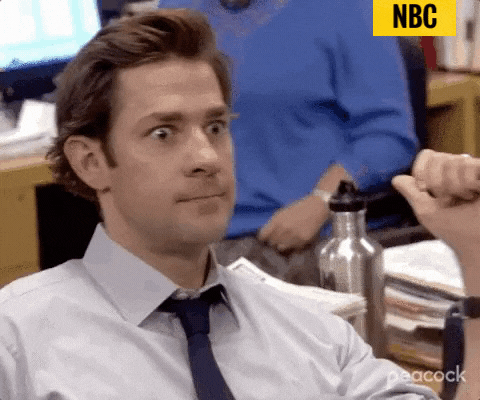 GIF of Jim Halpert speaking with excitement while clutching his fist, on the TV show &quot;The Office&quot; (US), with the caption &quot;Yes!&quot;, the text &quot;peacock&quot; on the bottom right, and the credit tag &quot;NBC&quot; located on the top right.