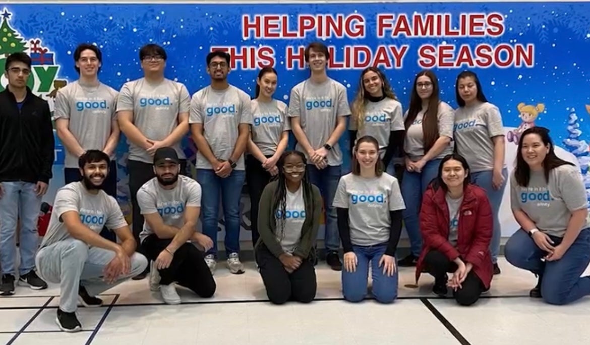 Nancy and her team pictured in a group photo for a charity event.