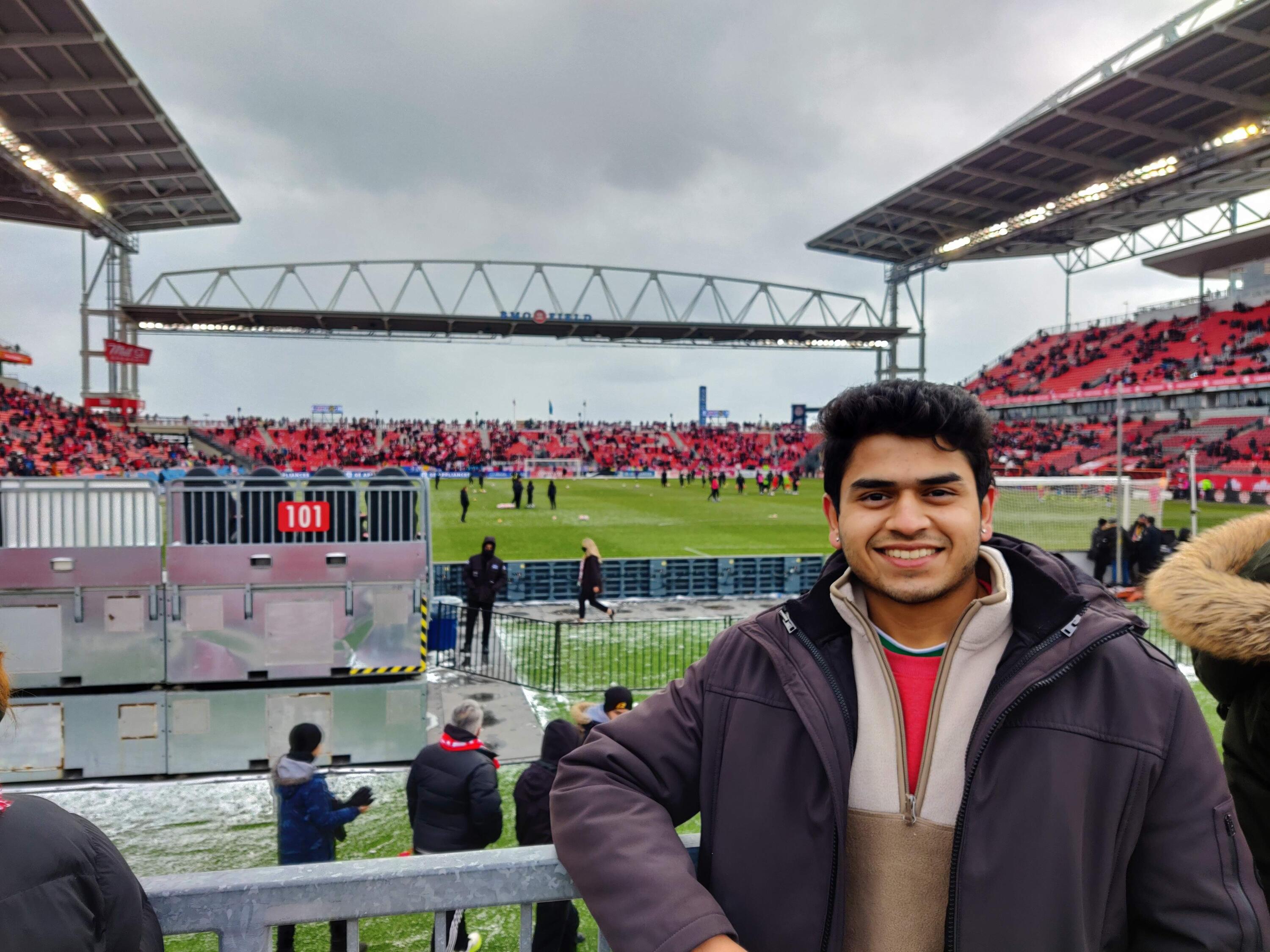 Anand at an outdoor stadium 