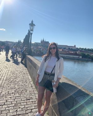 Anna standing on a bridge