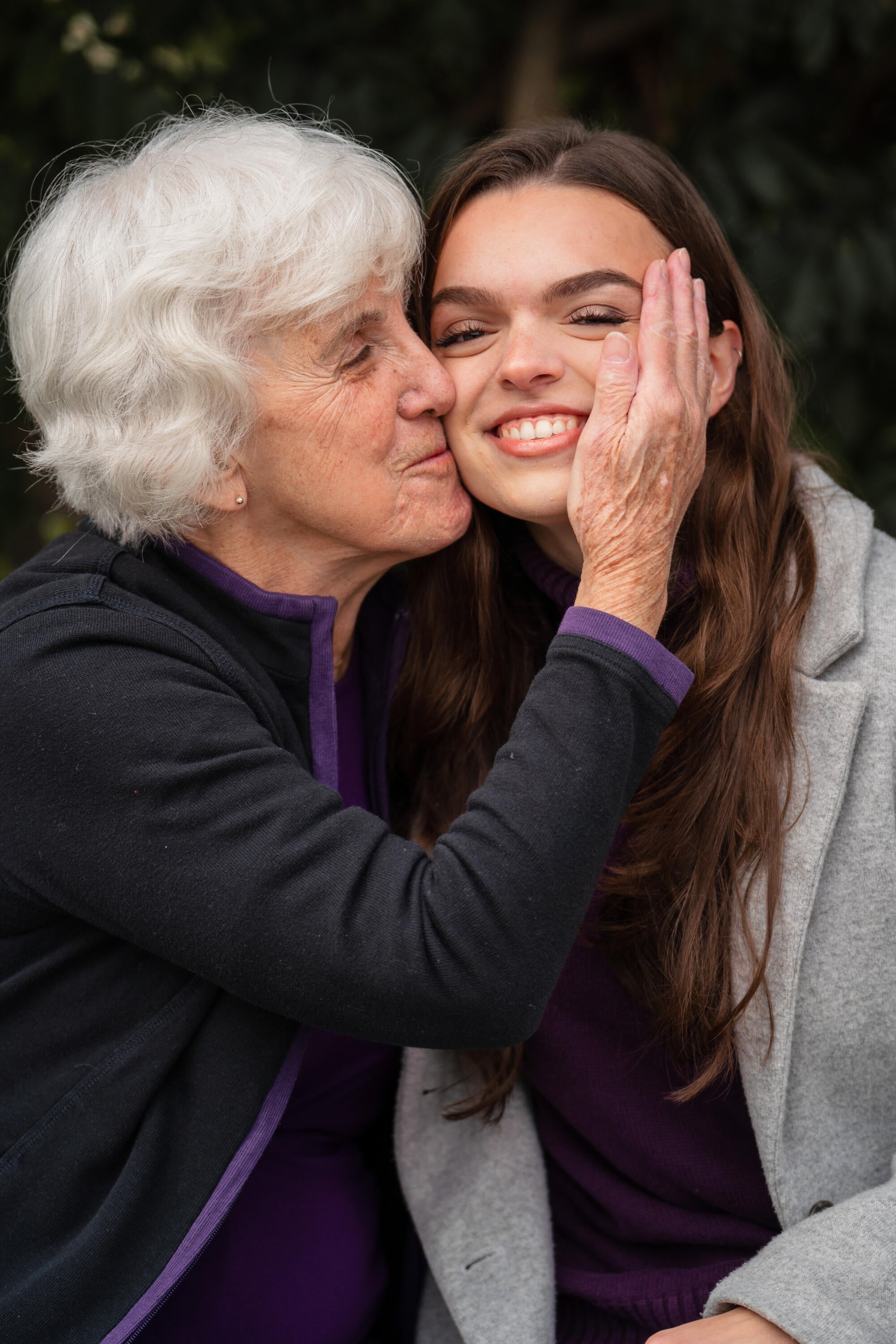Aubrey with an older woman embracing her. 