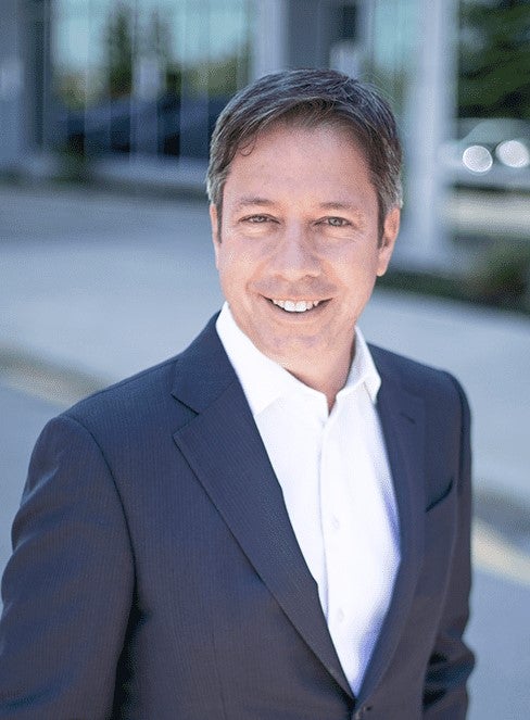 Photo of President of Microsoft Canada, Kevin Peesker, smiling outside