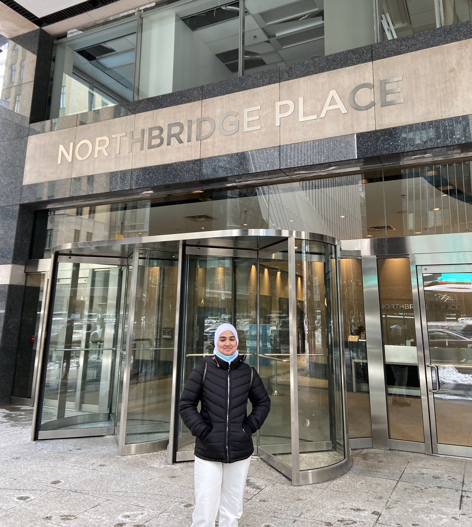 Habeeb Sultana standing in front of Northbridge Place in Toronto.