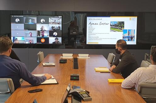 Ayman Gostar in a meeting room attending a virtual meeting