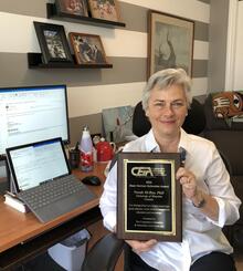 Norah McRae, Associate Provost for Co-operative Experiential Education, with her CEIA award
