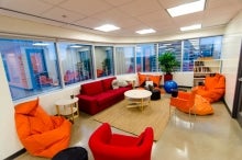 Wattpad's open workspace with red and orange furniture
