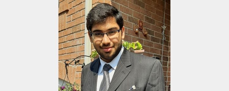 Rahul posing in a suit 