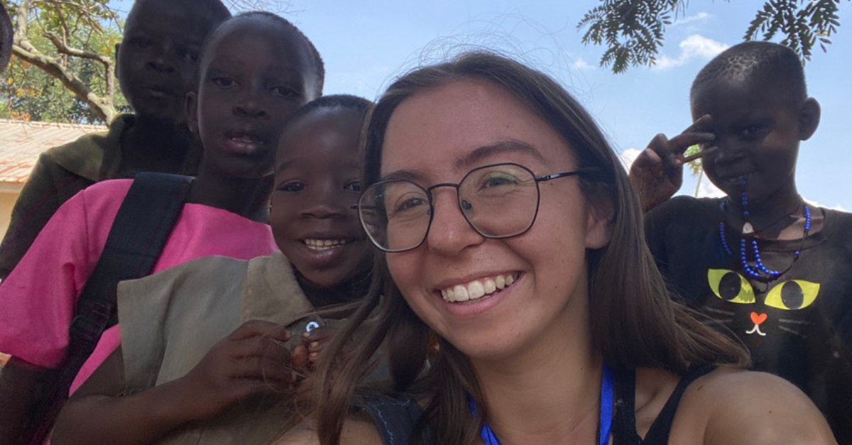 Samantha Kremer with children in Uganda